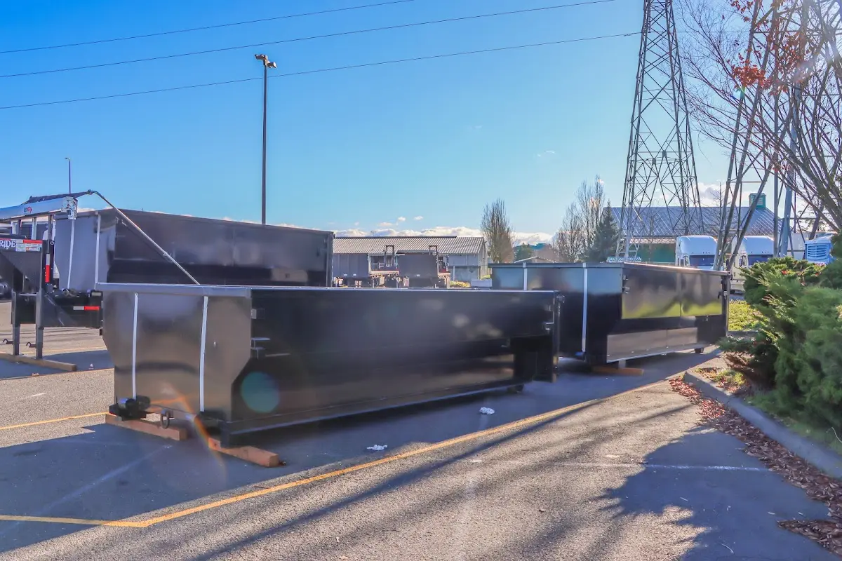 Roll-off dumpster ready for waste disposal at job site for Roofing Dumpster Rental in New Bern
